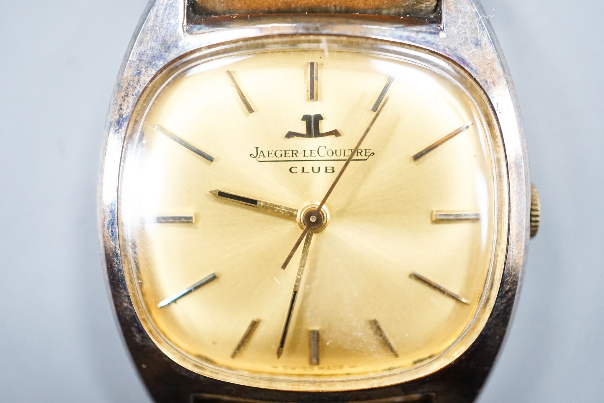 A gentleman's stainless steel Jaeger LeCoultre Club manual wind wrist watch, on associated strap, case diameter 32mm.